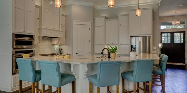 kitchen island with green chairs