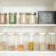 Photo by RDNE Stock project: https://www.pexels.com/photo/clear-glass-jars-on-white-wooden-shelf-8580793/ - pantry