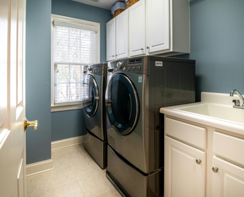 Photo by Curtis Adams: https://www.pexels.com/photo/front-load-washing-machine-beside-white-window-blinds-3935334/